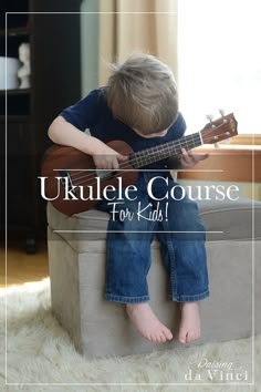 a young boy sitting on top of a box playing a ukulele guitar with the words ukulele course for kids above it