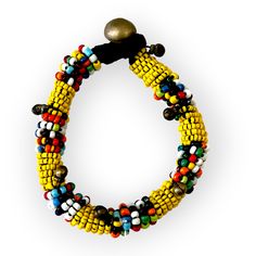 This colorful, beaded bracelet can be worn on its own or layered with some of your other favorite pieces. Vibrant comes to mind as it adds a pop of color to any outfit with its tribal inspired patterns. Some accessory options: tasseled Thai tribal necklace, geometrically inspired wood bead necklace, simple double pearl necklace, or the double strand necklace with geometric details Details: Beaded bracelet with a push button clasp. Clasp is either a small bell or charm. Size: length of beaded por Double Strand Necklace, Wood Bead Necklace, African Inspired Fashion, Necklace Simple, Small Charms, Brass Accents, Pale Green, Strand Necklace, Push Button