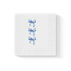 a white napkin with blue bows on it