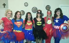 a group of women dressed up as superheros