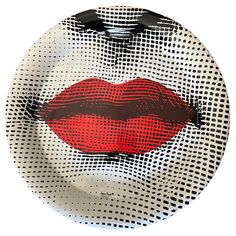 a plate with a red lip painted on it