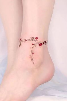 a close up of a person's foot with flowers on it