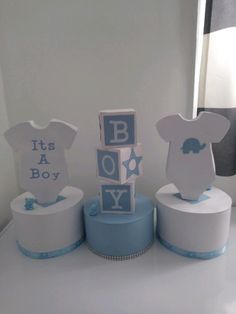 a baby shower cake with its name on the top and it's a boy decorations