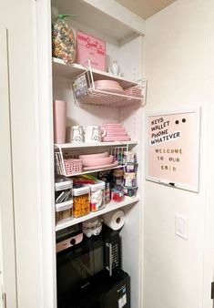 the pantry is stocked with dishes and other items