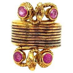 Ilias Lalaounis snake ruby gold ring Round-cut rubies of approximately 0.60 carat, 18 karat yellow gold, snakes motif; marked Ilias Lalaounis, A21 Size: 4.5 US Total weight: 11.6 grams Ruby Gold Ring, Gold Ring, Fashion Rings, Gold Rings, Ruby, Jewelry Rings, Size 4, Yellow Gold, Yellow