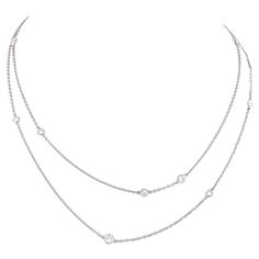 Circa 1980s, Platinum, by Elsa Peretti for Tiffany & Co. New York. This Diamonds by the Yard necklace is a fine example of Poretti's iconic Tiffany design. Uncommon in platinum, it is set with 3.0 carats of F-G colored, VS clarity diamonds (12 stones). Worn long, doubled, or as part of a multiples look, it stands out as exceptional fashion Tiffany style. Excellent condition. Quote: "I wanted to make diamonds a little more casual. -Elsa Peretti" Remark: "Only Tiffany can be this effortlessly clas Elsa Perreti, Elsa Peretti Necklace, Diamonds By The Yard Necklace, Diamond By The Yard, Diamonds By The Yard, 12 Stones, Elsa Peretti, Tiffany Style, Tiffany And Co