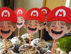 cupcakes with mustaches and hats on them