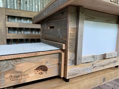 a close up of a chicken coop with the door open