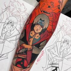 a person with a tattoo on their arm and some drawings behind them in the background