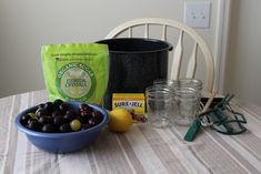 the table is set up with olives, lemons and other ingredients to make an appetizer