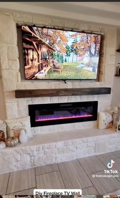 a large flat screen tv mounted above a fireplace