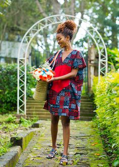 The stunning Carnation dress embraces the essence of African Ankara prints with its intricate patchwork pattern that celebrates the beauty of diversity and unity. Each patch tells a story, woven together in perfect harmony.The vibrant red fabric adorning the front of the dress instantly catches the eye, radiating warmth and energy. Designed to flatter all body types, this free dress provides a relaxed yet chic silhouette that gracefully drapes around your figure.  -This mini-Kaftan dress has pockets on both sides and features a low Vneck design.  -The model is wearing a UK 6/XS.  -She is 5'6/168 cm tall. SIZE GUIDE XXS/ UK 4 / US 0 =  B -32  W -24  H -34   XS / UK 6 / US 2 =  B -34  W -26  H - 36 S / UK 8 / US 4 =  B - 35  W - 28 H -38   M / UK 10 / US 6 = B - 36  W - 29 H -  39 L / UK 12 Red Bohemian Patchwork Dress, Bohemian Red Patchwork Dress, Red Bohemian Dress With Traditional Patterns, Bohemian Red Dress With Traditional Patterns, Red Cotton Batik Print Dresses, Red Cotton Dress With Batik Print, Red Cotton Patchwork Dress, Red Short Sleeve Dress With Batik Print, Free Dress