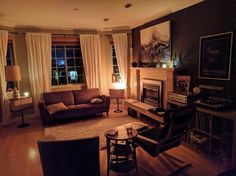 a living room filled with furniture and a fire place