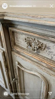 an old dresser has been painted white