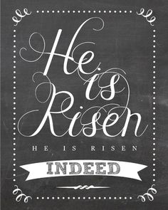 a chalkboard sign with the words he is risen written in white ink on it