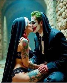 a man and woman dressed as the joker kissing