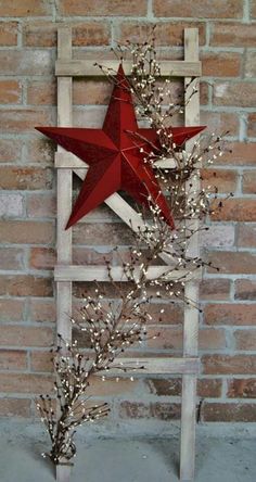 a red star on top of a wooden ladder