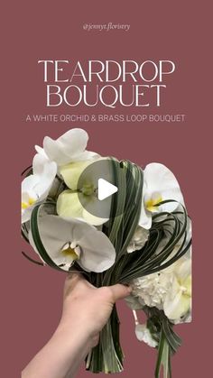 a hand holding a bouquet of white orchids and greenery with the words teardrop bouquet