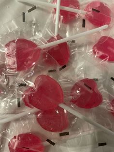 several lollipops are wrapped in plastic and placed on top of each other