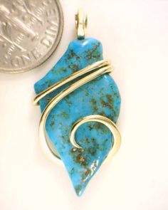 14.47ct Arizona Blue Turquoise in 14kt Gold Art Wrap Pendant  14.47 carats total weight   CHECK OUT OUR OTHER AUCTIONS AND EBAY STORE!!! Total weight 14.47 carats including wrap Size 32 mm by 15 mm by 6 mm including wrap   Up for sale is a beautiful and unique piece of  Sleeping Beauty Arizona Turquoise in a neat freeform shape artfully wrapped in a tension forged 14kt gold wire wrap. It is a wonderful vibrant blue color that will be a spectacular highlight to any outfit. This is an American mined stone and is all natural no dyes or coloring. To top it off are the glowing waves of 14kt gold securely grasping the stone and setting it off to perfection. DO NOT LET THIS ONE SLIP AWAY!! Wire wrapping or Wire sculpture is one of the oldest techniques for making jewelry by hand. But, the use of