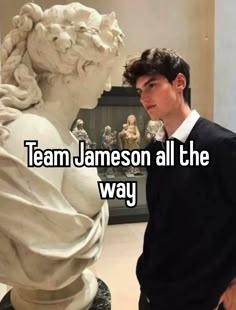 a man standing next to a statue with the words team jameson all the way