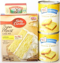 three cans of cake mix next to a can of lemon creme on a white surface