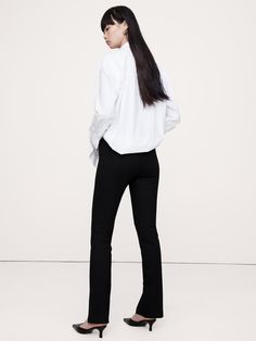 This skinny pant is designed for comfort, cut from our Everywhere Ponte fabric with a split-hem detail at the front.   We developed this special Ponte de Roma, enhancing its softness with special stretch fibers that create a smooth, supportive fit that always looks polished.   4-way Stretch Skinny Fit: High rise (10").  Skinny fit with a split-hem detail.  Full length.  Sustainability: Made with Birla Livaeco™ viscose, a fiber derived from renewable wood resources and sourced from responsibly ma Ponte Fabric, Ponte Pants, How To Hem Pants, Family Event, Split Hem, New Woman, Black Pants, Banana Republic, Sustainability