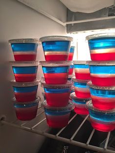 several cups with red, white and blue colors are stacked on top of each other