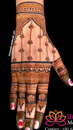 the hand is decorated with henna designs