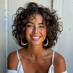 Discover 30 chic short hairstyles that suit every hair type and texture. Perfect for your next salon visit! Haircuts To Give Curly Hair Volume, Middle Part Curly Short Hair, Permed Layered Bob, Haircuts For Curly Hair With Layers, Short Curly Hair Lots Of Layers, Wavy Feathered Hair, Short Curly Hair Bangs Hairstyles, Curly Feathered Hair, Short Curly Haircuts Fine Hair