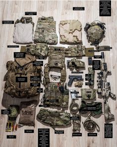 the contents of an army uniform laid out on a wooden floor with instructions and pictures