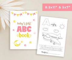 two children's coloring books with the title baby's first abc book next to it