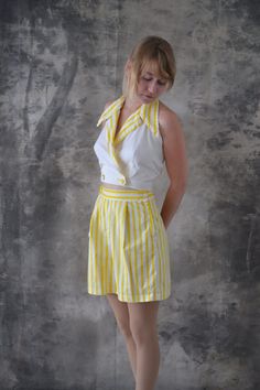 "Yellow and white striped playsuit circa 1950s. Features cropped halter top with oversized collar and double buttons, high-waisted shorts zip up side with metal zipper, one button at waist. In good condition although white cotton in top shows some small stains.   Measurements:  waist ~ 26\" shorts length ~17\" top length ~ 15\" bust ~ 16.5\" across  International buyers: Please check your countries customs fees, they are not included in our shipping rates." 50s Inspired Fashion, 50s Outfit, 1950s Summer, Suit Shorts, Play Suit, Fifties Fashion, Fashion 1950s, Vintage Swimwear, Vintage Inspired Fashion