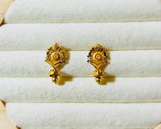 22k Solid Gold Stud-Vintage Gold Stud-Indian 22k Gold Floral Stud with minimal handcrafted works-Real Gold Stud-Gold Stud with Gold ball This is beautifully handmade Indian 22k Solid Gold Stud Earrings with dangling gold ball  that gives you classy look and suits for everyday wear or occasion wear both . PRODUCT SPECIFICATION: Material: 22k Solid Gold Weight: 2.58 gram  We accept Custom Order and custom size as well! Customer Satisfaction is our utmost priority, feel free to have any query, would love to hear from you! Jai Shree Shyam🙏🙏 Happy Shopping 🛍 Ornate Dual-tone Gold Earrings, Delicate Gold Bracelet, 22k Gold Earrings, Gold Earrings Indian, Shree Shyam, Antique Gold Earrings, New Gold Jewellery Designs, Bangles Design, Floral Studs