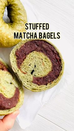 a person is holding a bagel in their hand with the words stuffed matcha bags on it