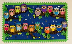 an owl themed bulletin board with many owls sitting on the branches and stars in the sky