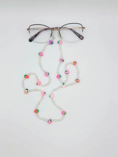 Cutie little fruity glasses chain! This glasses chain is sweet and dainty with its pearls, berries and cherries. This is perfect for completing your summer outfit, or just to keep your everyday glasses or sunglasses safe. Handmade Glasses Chains For Summer Party, Multicolor Glasses Chains For Summer Parties, Handmade Summer Party Glasses Chains, Multicolor Summer Party Glasses Chain, Trendy White Glasses Chains With Colorful Beads, Summer Party Multicolor Glasses Chains, White Glasses Chains As Summer Gift, White Glasses Chains For Summer Gift, Summer Glasses Chains With Colorful Beads As Gift