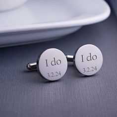 One of the best wedding day gifts a bride can give a groom is cufflinks. Make the gift amazing with a little personalization! These stainless steel I Do cufflinks have ‘I Do’ and the wedding date engraved on them. Available in stainless steel, gold plated steel, rose gold plated steel, and gunmetal plated steel. Choose from round or square cufflinks measuring 5/8-inch each. We know he's going to love these! Come see all of the personalized accessories we make for the wedding party here at Love, Silver Engraved Cufflinks For Wedding, Personalized Cufflinks For Wedding And Father's Day, Personalized Round Cufflinks For Wedding, Personalized Silver Cufflinks For Wedding, Personalized Wedding Cufflinks, Rose Gold Square, Wedding Day Gifts, Engraved Wedding, Gold Cufflinks