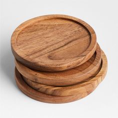 three wooden plates stacked on top of each other