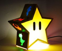 a star shaped light with the shape of a child's head on top of it