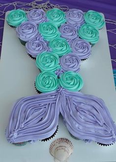 cupcakes are arranged in the shape of a mermaid tail