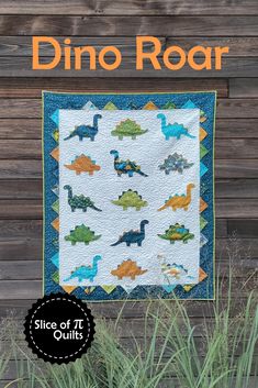 the dino roar quilt pattern is featured in front of a wooden wall with grass and plants