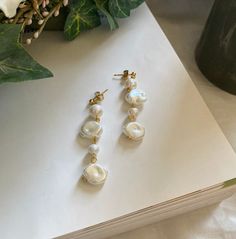 Handmade pearl earrings with nickel-free, gold-plated sterling silver hardware. Each pearl is unique and shaped in its own way so styles will vary slightly. Unique and sophisticated style to mix and match with any look.  Packing and Shipping:  Each order is handcrafted and typically made to order. So processing times typically take 5 days. We will do our best to get these created and shipped out to you as quickly as possible. If you need to relay information regarding shipping, please message us directly.  Please see our Policies section for more information about turnaround times. As soon as your item ships, Etsy will send a shipping notification that includes tracking information. Our packaging is important to us, and so is sustainability! Products are shipped with recycled and Sapphire White Pearl Drop Earrings In Brass, Brass Pearl Earrings With Pearl Charm As Gift, Brass Pearl Earrings As A Gift, Pearl Charm Earrings In Brass As A Gift, Gift Single Pearl Earring In Brass, White Baroque Pearl Earrings As A Gift, Handmade Pearl Earrings, Gold Pearl Earrings, Elegant Jewelry