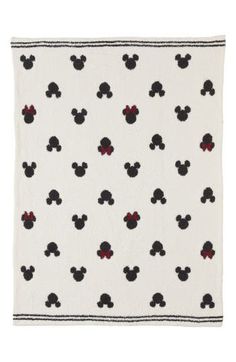 a mickey mouse blanket with black and red dots