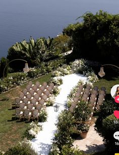 an aerial view of a wedding venue with chairs set up on the lawn, overlooking the ocean