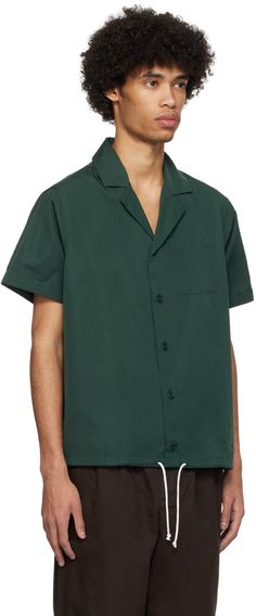 Cotton poplin shirt. · Open spread collar · Button closure · Patch pocket at chest · Drawstring at hem Supplier color: Dark green Green Button-up Camp Shirt With Pockets, Green Relaxed Fit Collared Camp Shirt, Green Lapel Collar Shirt For Work, Green Collared Tops With Welt Pockets, Green Cotton Shirt With Pockets, Green Cotton Shirt With Lapel Collar, Green Collared Camp Shirt With Button Closure, Classic Green Cotton Camp Shirt, Green Camp Shirt With Button Closure