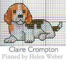 a cross stitch pattern with a dog on it