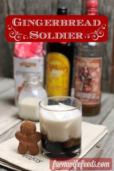 a gingerbread soldier is sitting on a napkin next to a glass of milk and some other ingredients