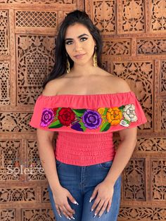 This Beautiful Off the Shoulder Crop Top is the perfect Top for a fun day out. It's made out of cotton, has an elastic waist and is full of vibrant embroidered florals. Please note: You may purchase the jewelry in a variety of colors and styles found in another post. Fitted Pink Embroidered Tops, Fitted Embroidered Pink Tops, Fiesta Tops With Floral Embroidery, Fitted Top With Multicolor Embroidery For Vacation, Fitted Tops With Multicolor Embroidery For Vacation, Fitted Multicolor Embroidered Top For Vacation, Red Tops For Fiesta In Spring, Red Tops For Spring Fiesta, Embroidered Short Sleeve Top For Cinco De Mayo