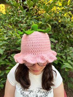 Embrace the whimsy of nature with this delightful handmade crochet bucket hat! Designed to mimic the look of a ripe strawberry, this light pink hat is topped with a charming cluster of green leaves, making it the perfect accessory for anyone who loves a touch of playful fashion. The soft scalloped edges add an extra layer of cuteness, making this hat as comfortable as it is stylish. - **Materials Soft and durable yarn, ensuring a cozy fit and long-lasting wear. - **Size Available in all sizes: N Whimsical Pink Handmade Crochet Hat, Whimsical Handmade Pink Crochet Hat, Whimsical Pink Hand-knitted Crochet Hat, Pink Crochet Hat, Fun Style, Cute Crochet Hat With Curved Brim, Cute Crochet Brimmed Bucket Hat, Cute Pink Crochet Bucket Hat, Pink Crochet Hat As A Gift, Pink Crochet Hat Made Of Yarn As A Gift